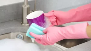 Why is it not recommended to wash dishes in a sponge?