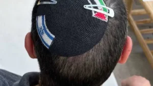 Writer Detained in Israel for Wearing Kippah Featuring Flags of Two States